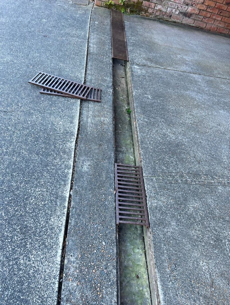 Driveway drain cleared after cleaning