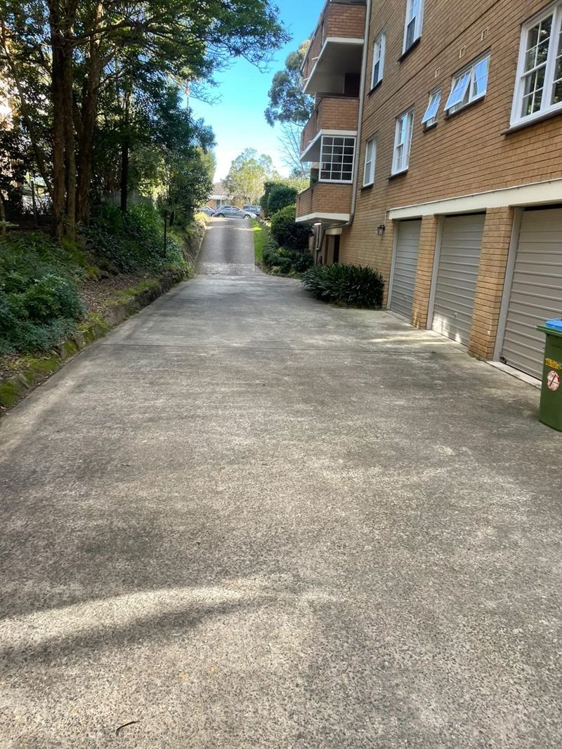 Swept driveway beside a strata building