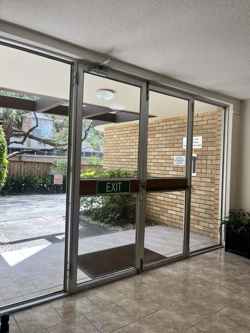 Clean glass entrance doors and lobby floor