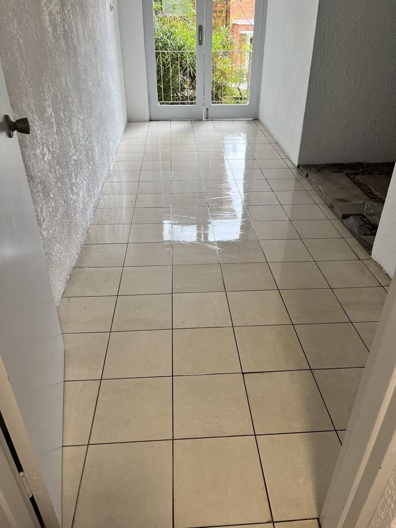 Freshly mopped tiled hallway